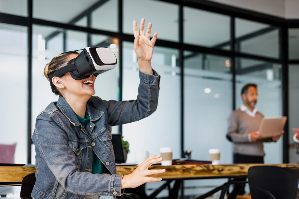 young hispanic woman using virtual reality glasses at office in Mexico Latin America, latin people and teamwork working together in vr technology