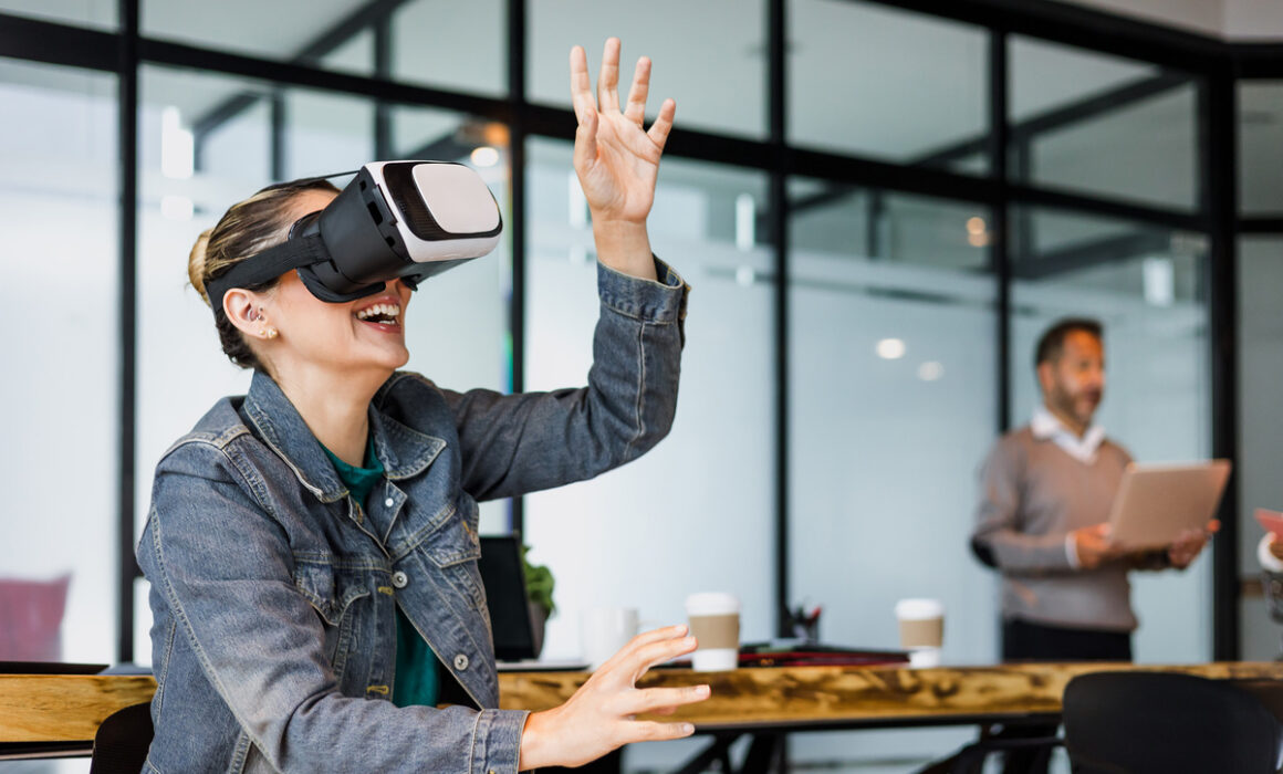 young hispanic woman using virtual reality glasses at office in Mexico Latin America, latin people and teamwork working together in vr technology