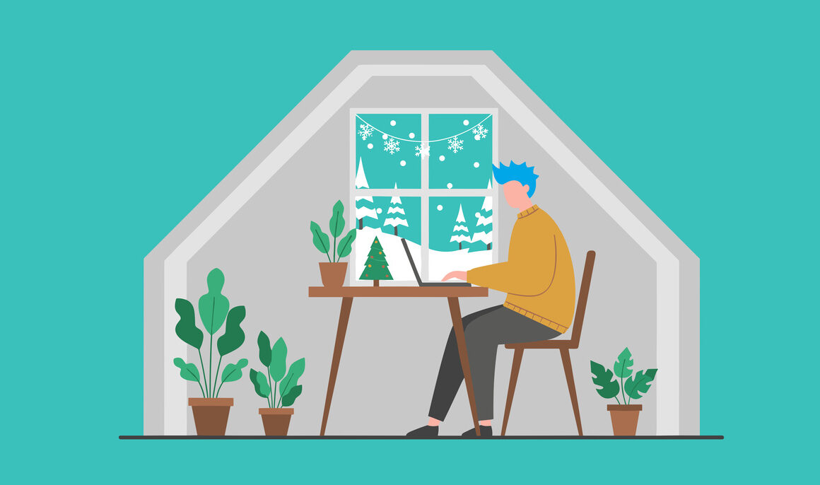 Remote worker in a winter home office with Christmas decorations and snow falling outside